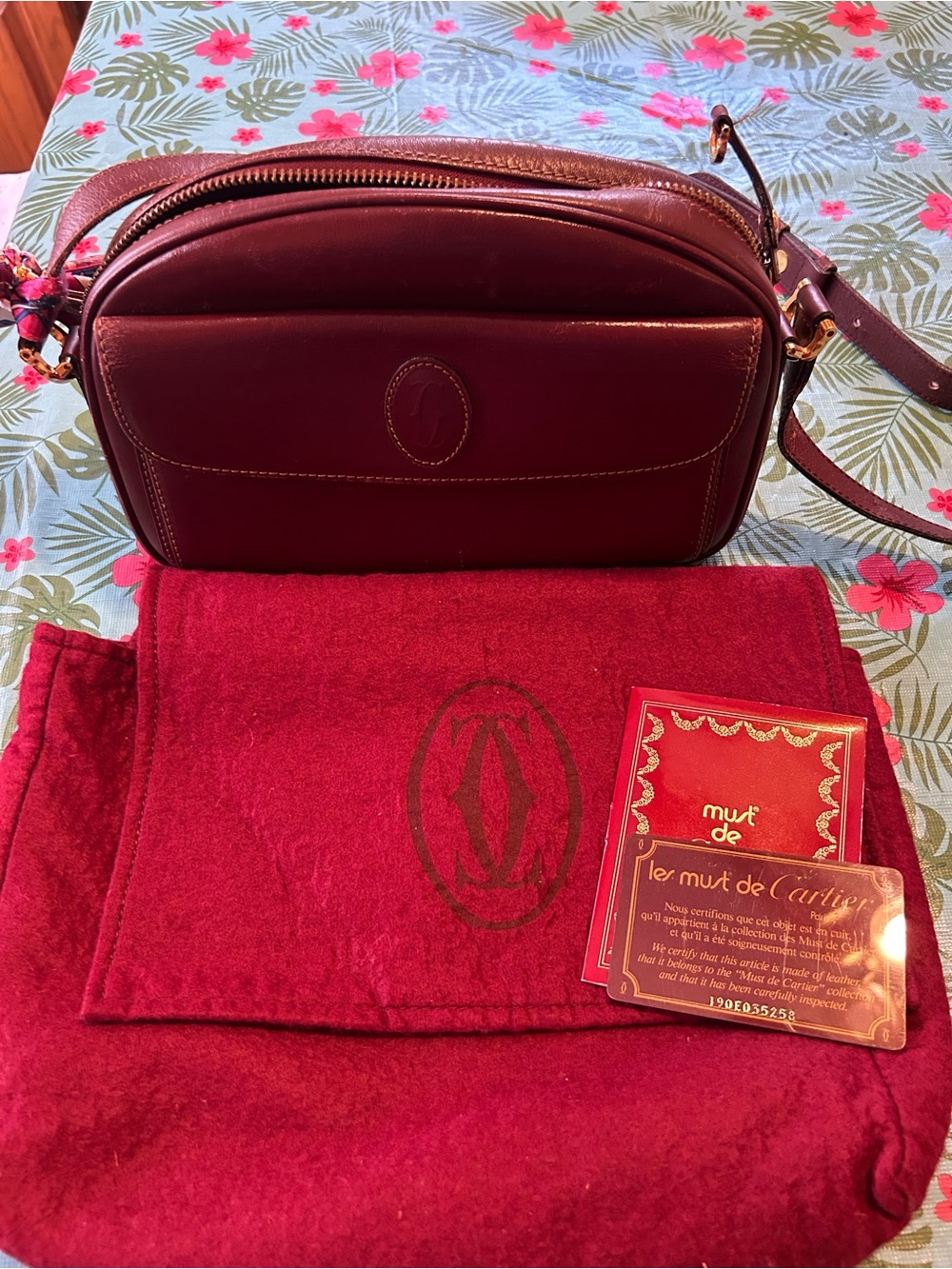 Cartier Burgundy Leather Crossbody with Gold-Tone Hardware. Dust bag and COA